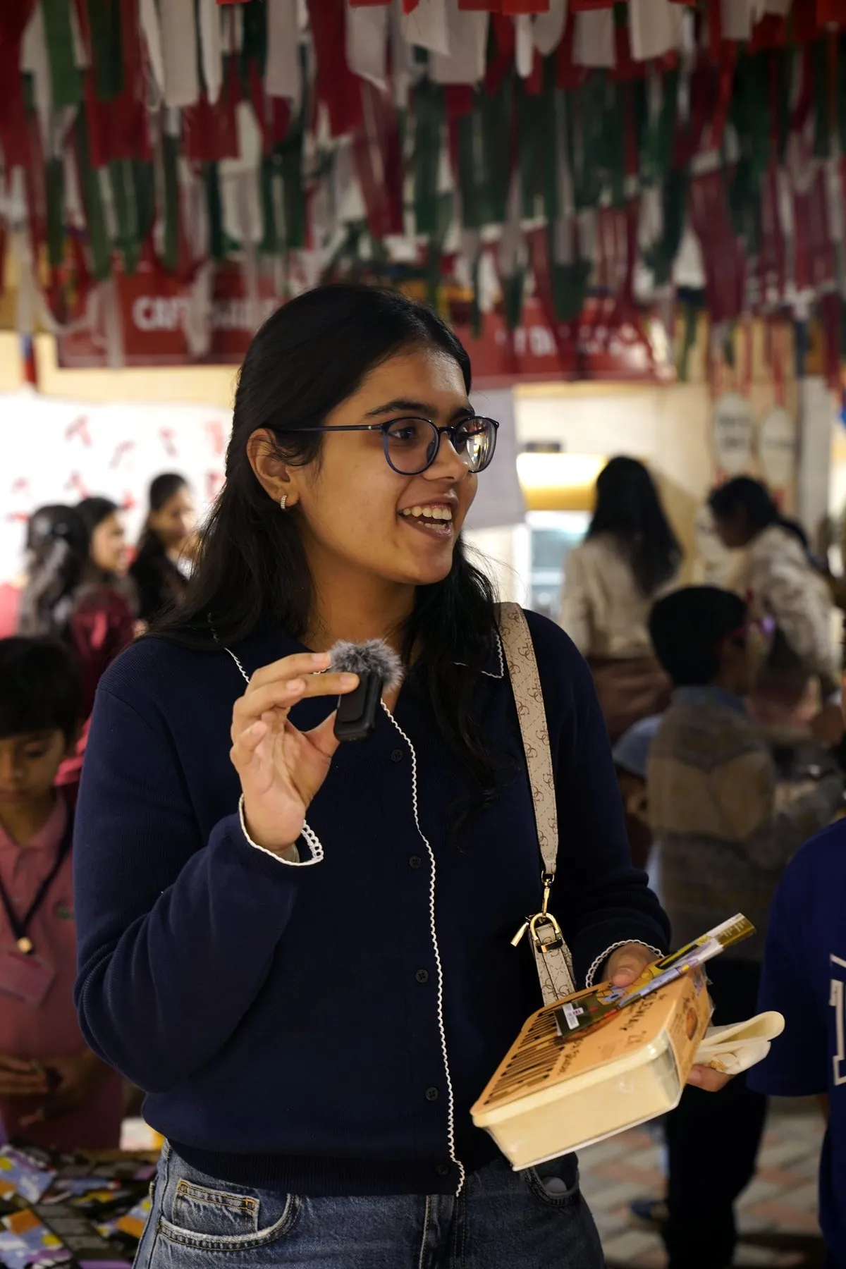 A visitor taking her first bite of a bajra cookie