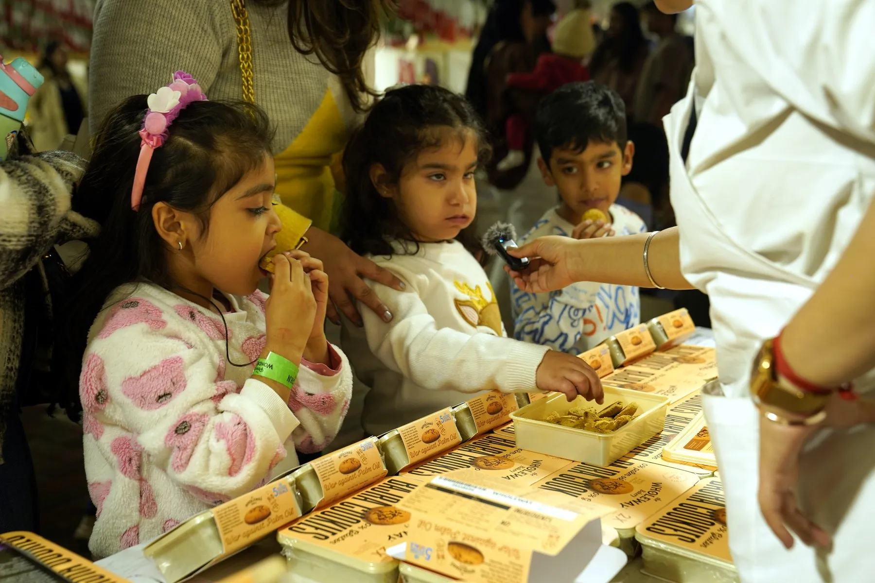 Children tasting Wholeway cookies